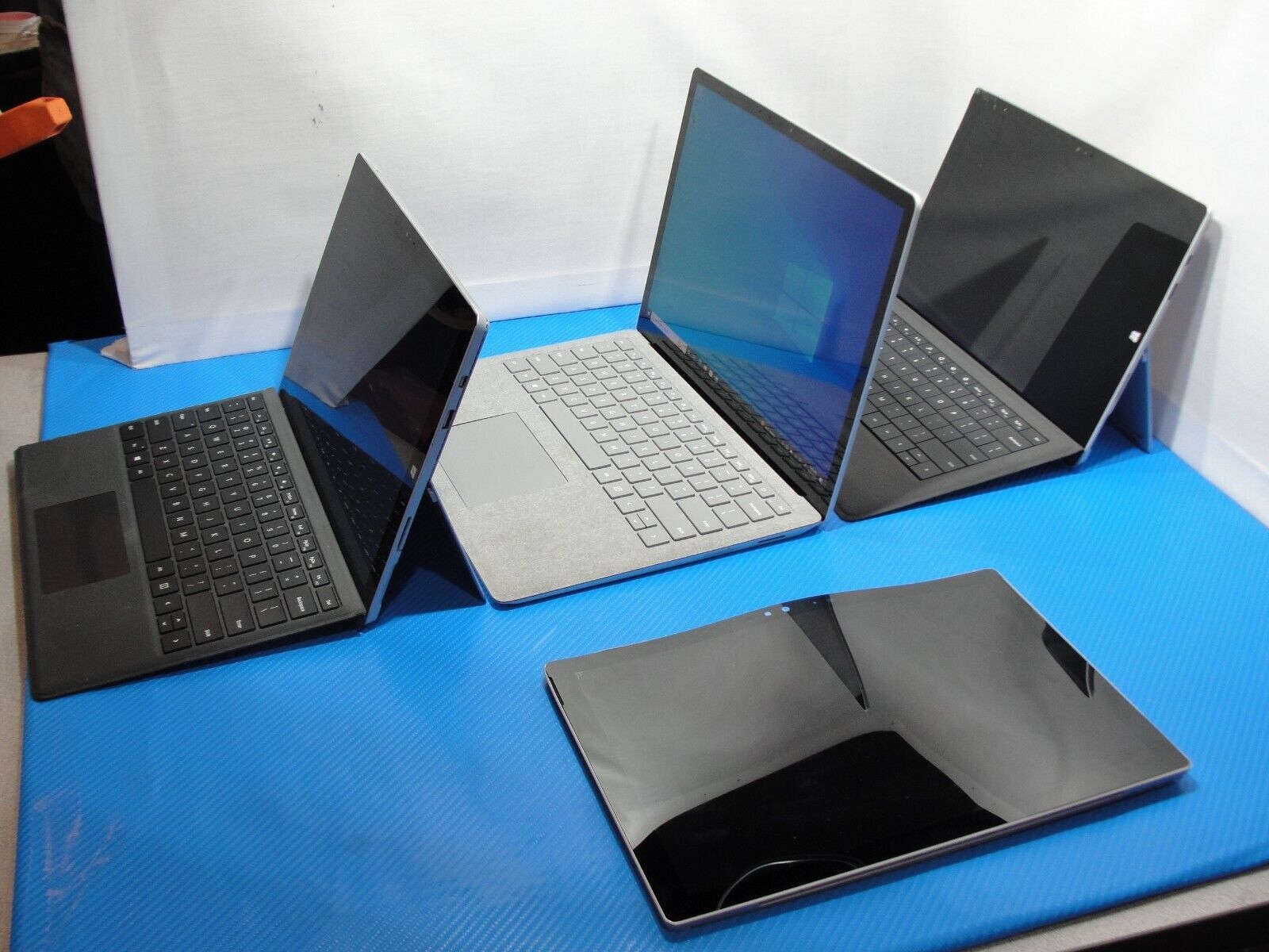 Mixed lot bundle of Surface devices, Pro 3/4/laptop, AS IS for parts or repair