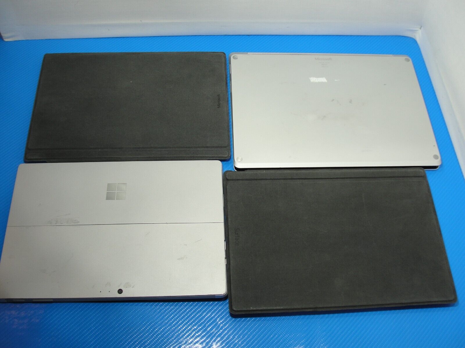 Mixed lot bundle of Surface devices, Pro 3/4/laptop, AS IS for parts or repair